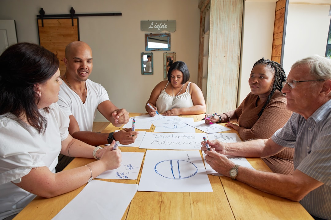 Multidisciplinary practitioners collaborating in a team meeting